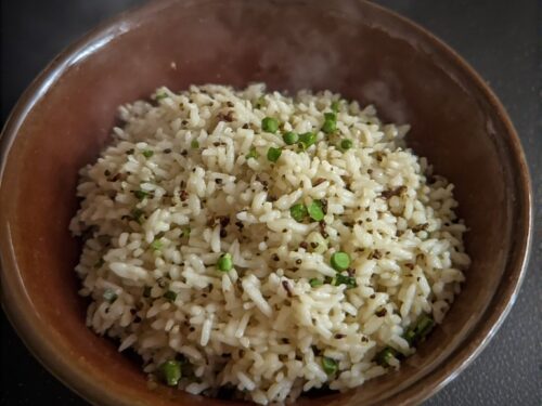 Fluffy white long-grain basmati rice speckled with toasted cumin seeds